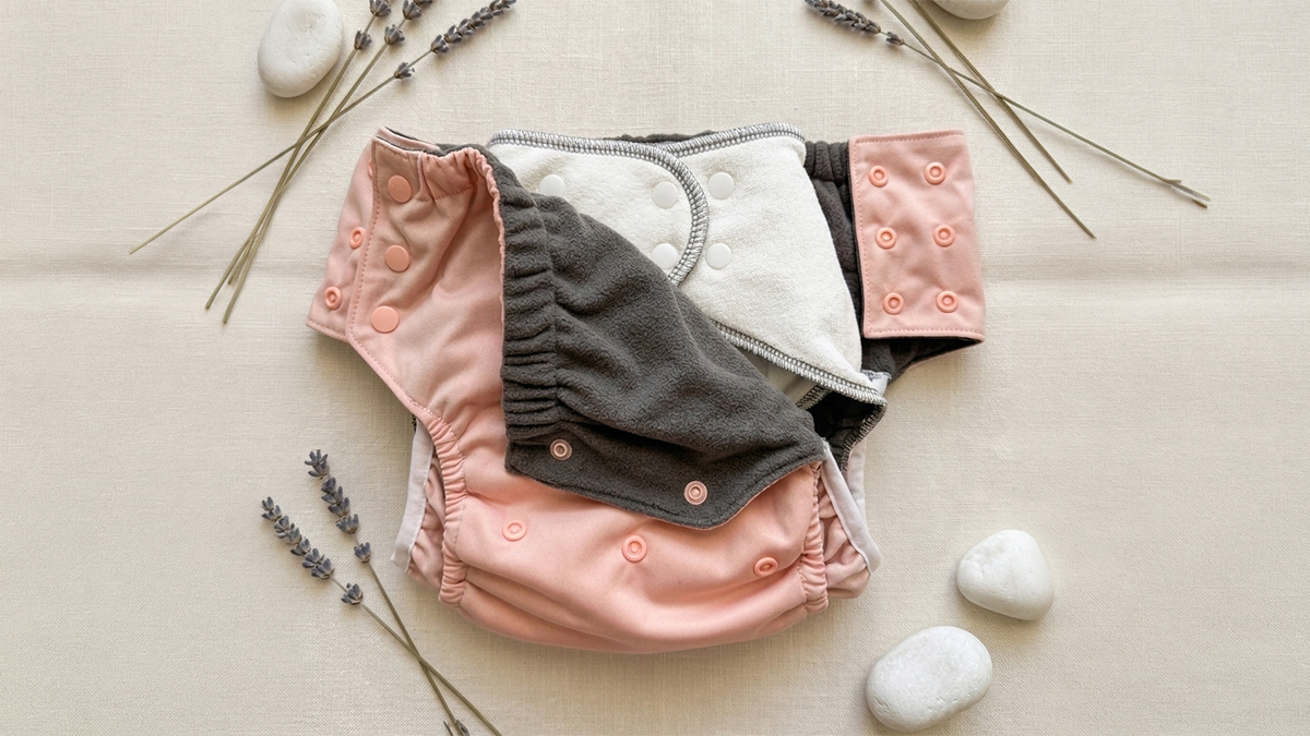 Close-up of EcoAble cloth diaper system showing soft bamboo fabric texture and assembled fit for teen comfort
