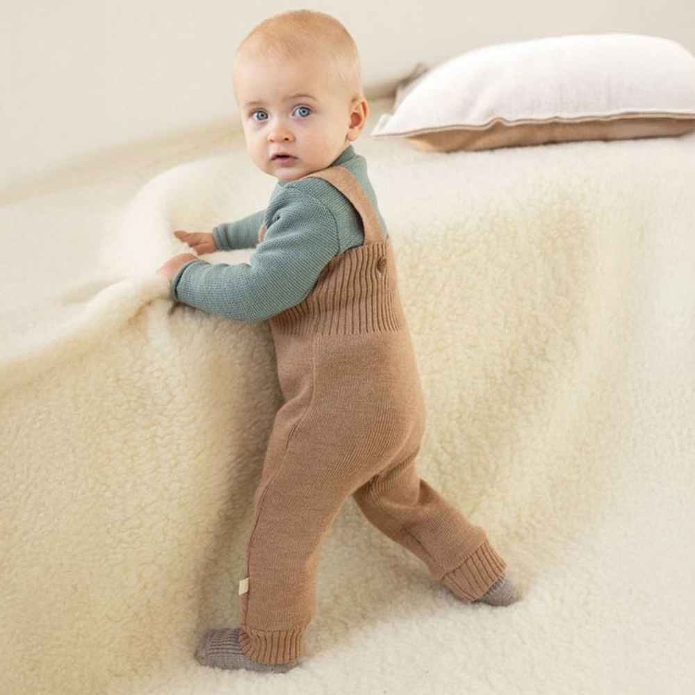 Disana knitted pants for babies and toddlers in organic merino wool—stretchy mid layer warmth