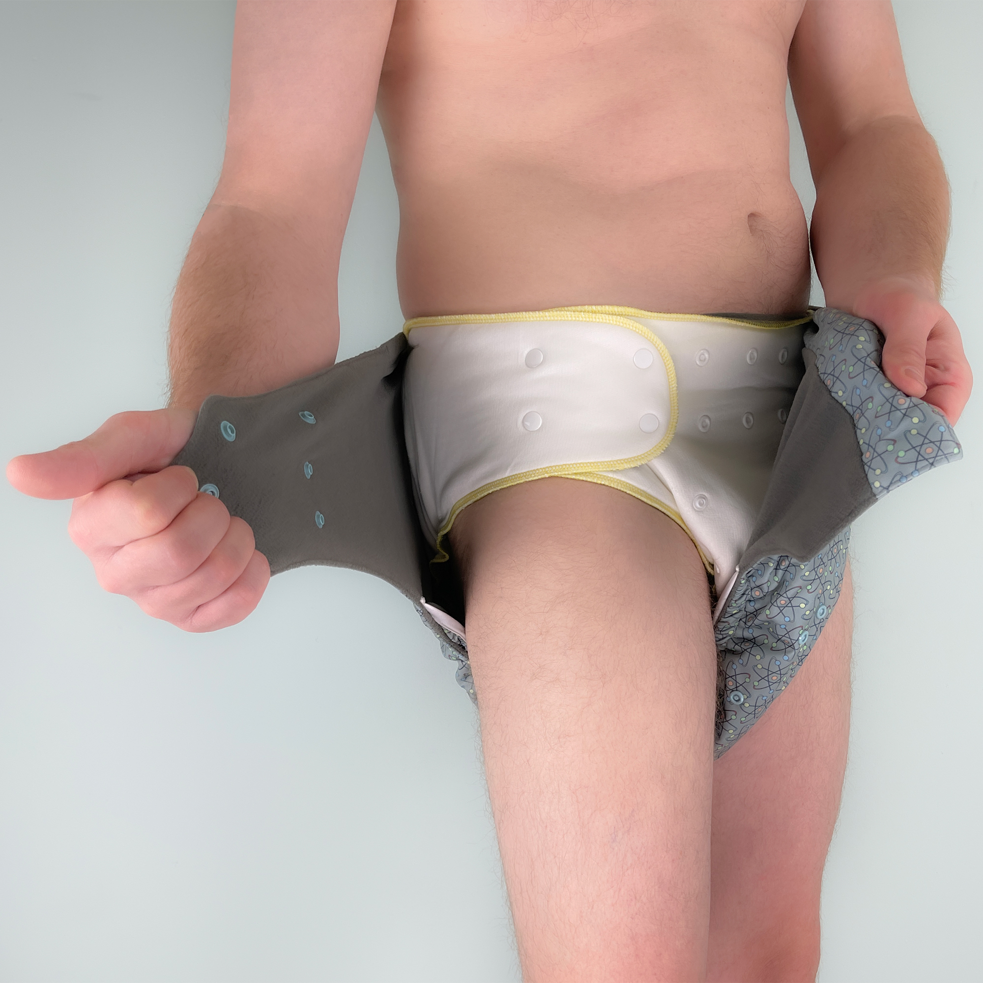 EcoAble Pocket Cloth Diaper 2.0 Nighttime Fit — Adult Cloth Diaper with Fitted Diaper and Pocket Shell EcoAble Pocket Cloth Diaper 2.0 Day & Night Set on an adult model, demonstrating secure nighttime fit with fitted diaper and pocket shell